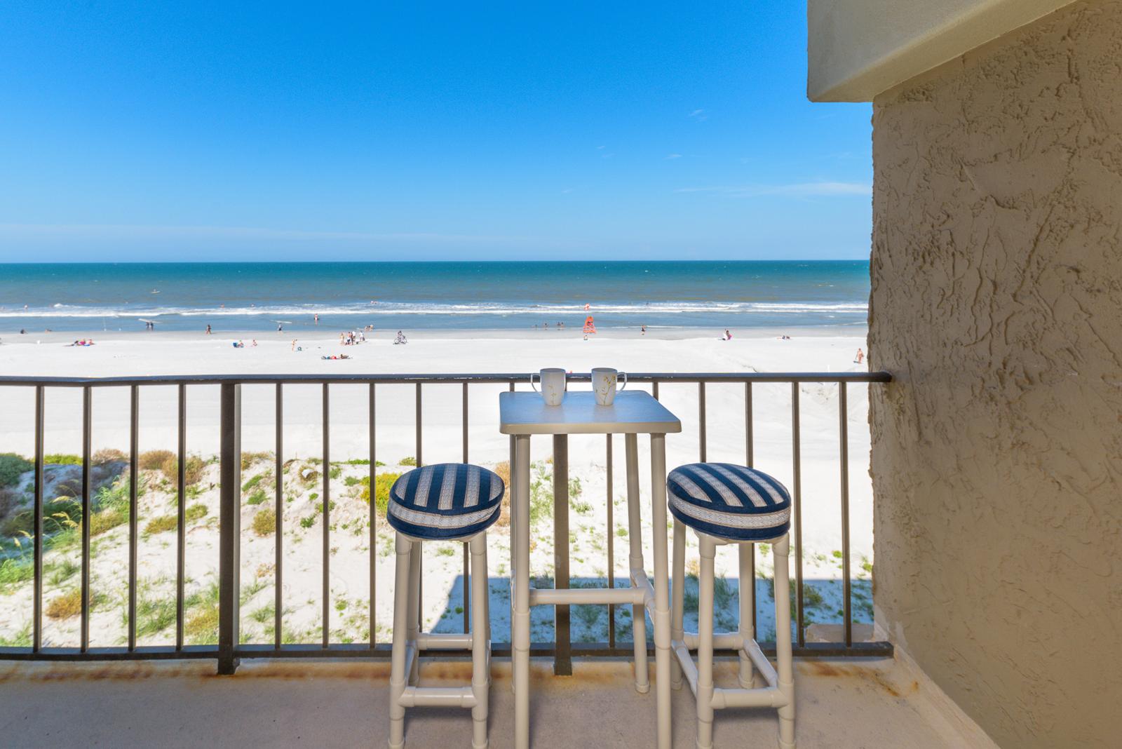 Morning coffee on a Charming Beach balcony overlooking the Atlantic